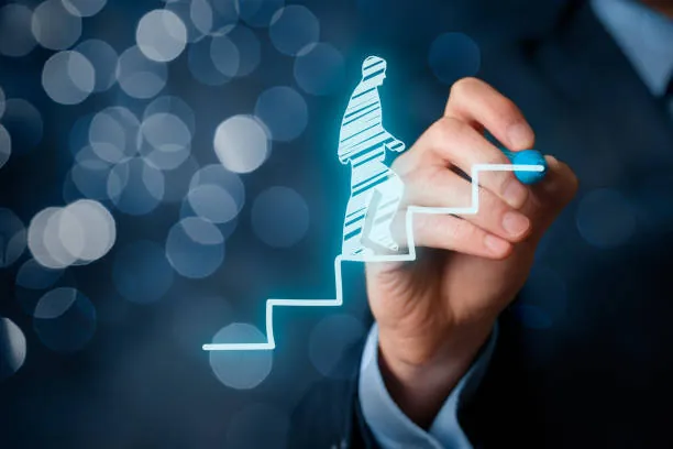 A hand drawing a glowing staircase for a figure climbing it